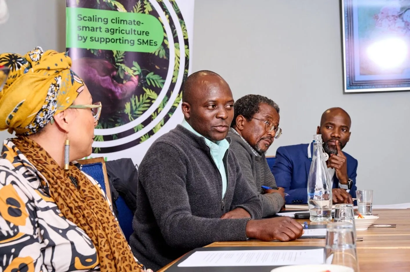 A policy dialogue session around a boardroom table